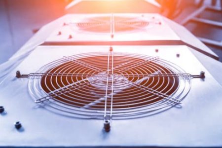 HVAC unit with visible metal fan grills, highlighting technology and design relevant to HVACR trends in 2024.