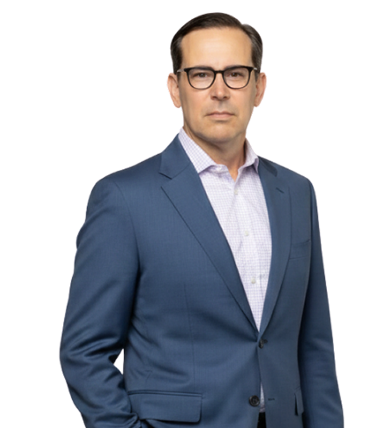 Patrick Archer, M&A Advisor at CII Advisors, standing confidently in a blue suit and glasses, emphasizing professional expertise in mergers and acquisitions.