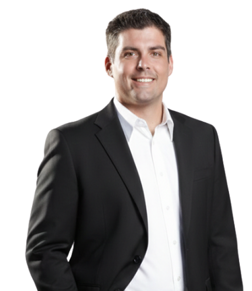 Ken Kelly in a formal black suit, smiling confidently, representing CII Advisors and his business expertise.