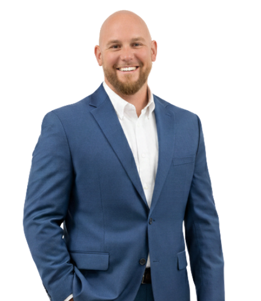 Kevin Broderick, business advisor at CII Advisors, standing confidently in a blue suit and white shirt, smiling against a plain white background.